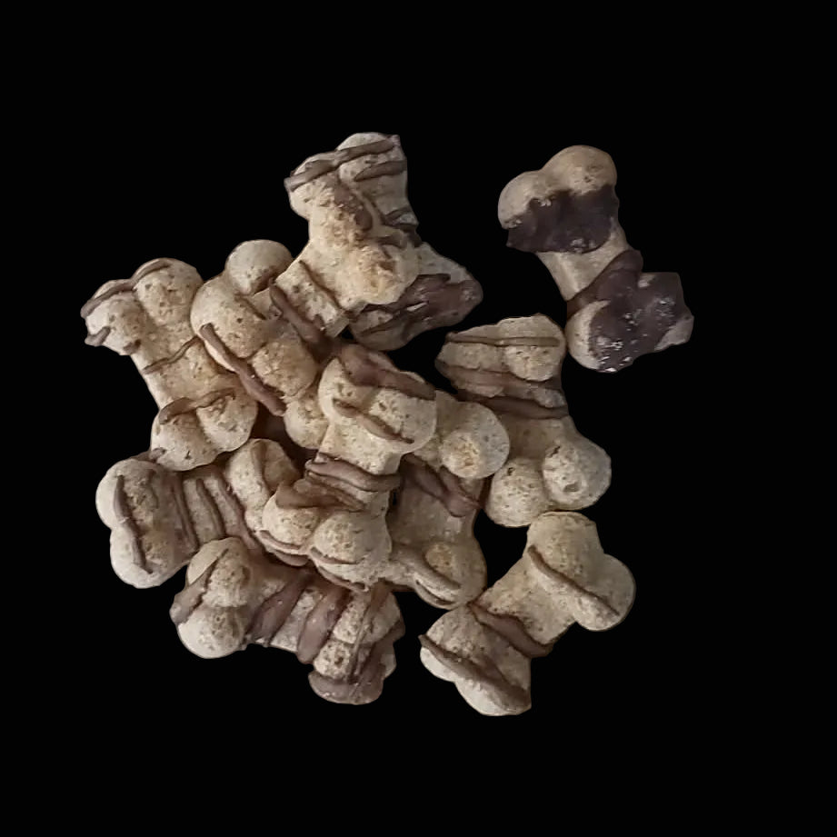 Small pile of dog treats on a wooden surface
