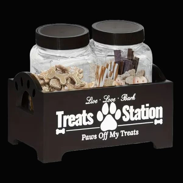 Dog treats station with two jars and a black holder featuring text and a paw print design.