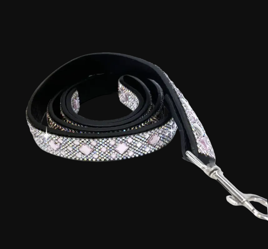 Black dog leash with pink and clear gemstones on a black background