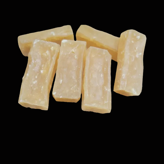 Dried Cheese chews for dogs on black background