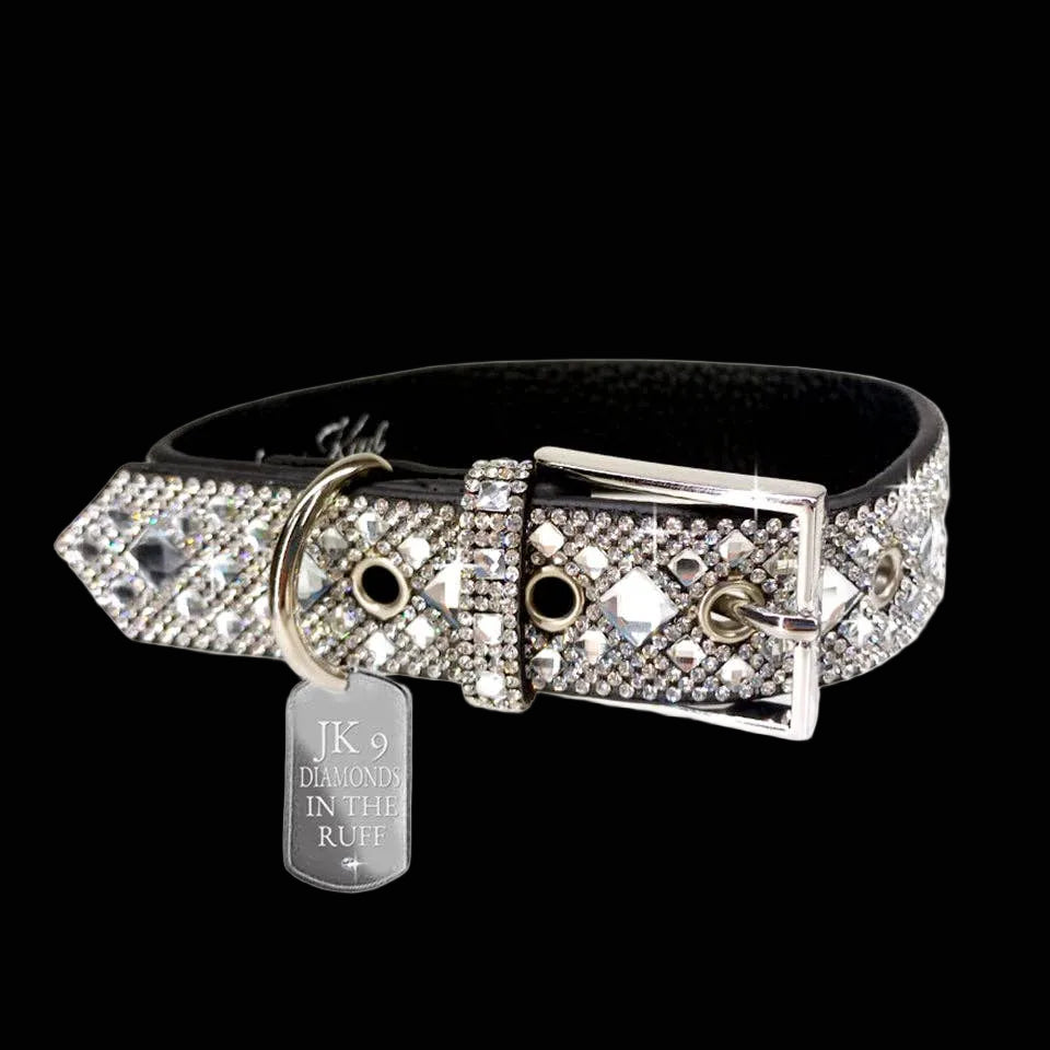 Black dog collar with crystal embellishments and a silver tag on a white background