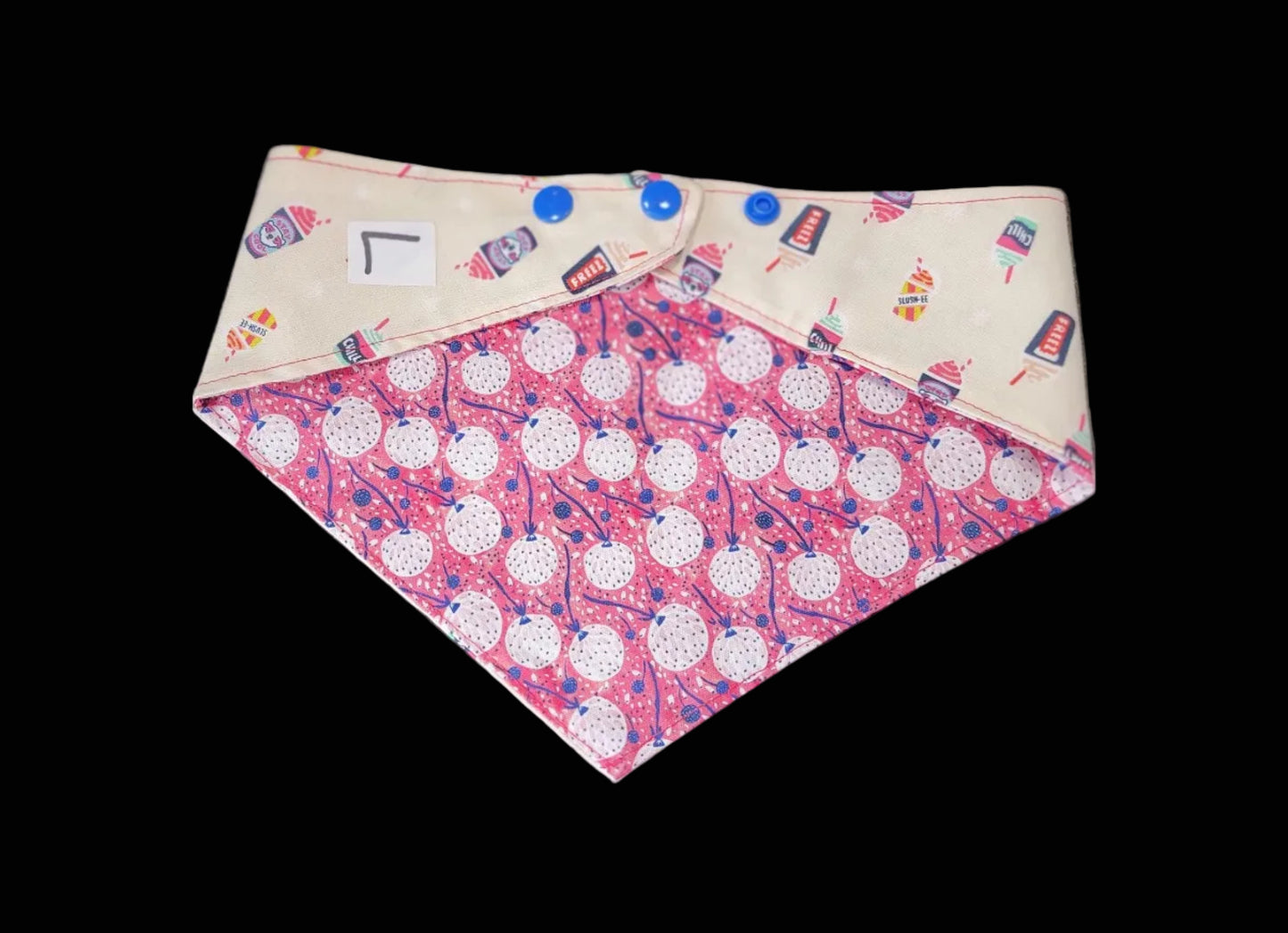 Fabric with red and white pattern on a dark surface