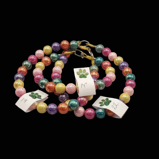 Colorful beaded necklace with tags on a black background