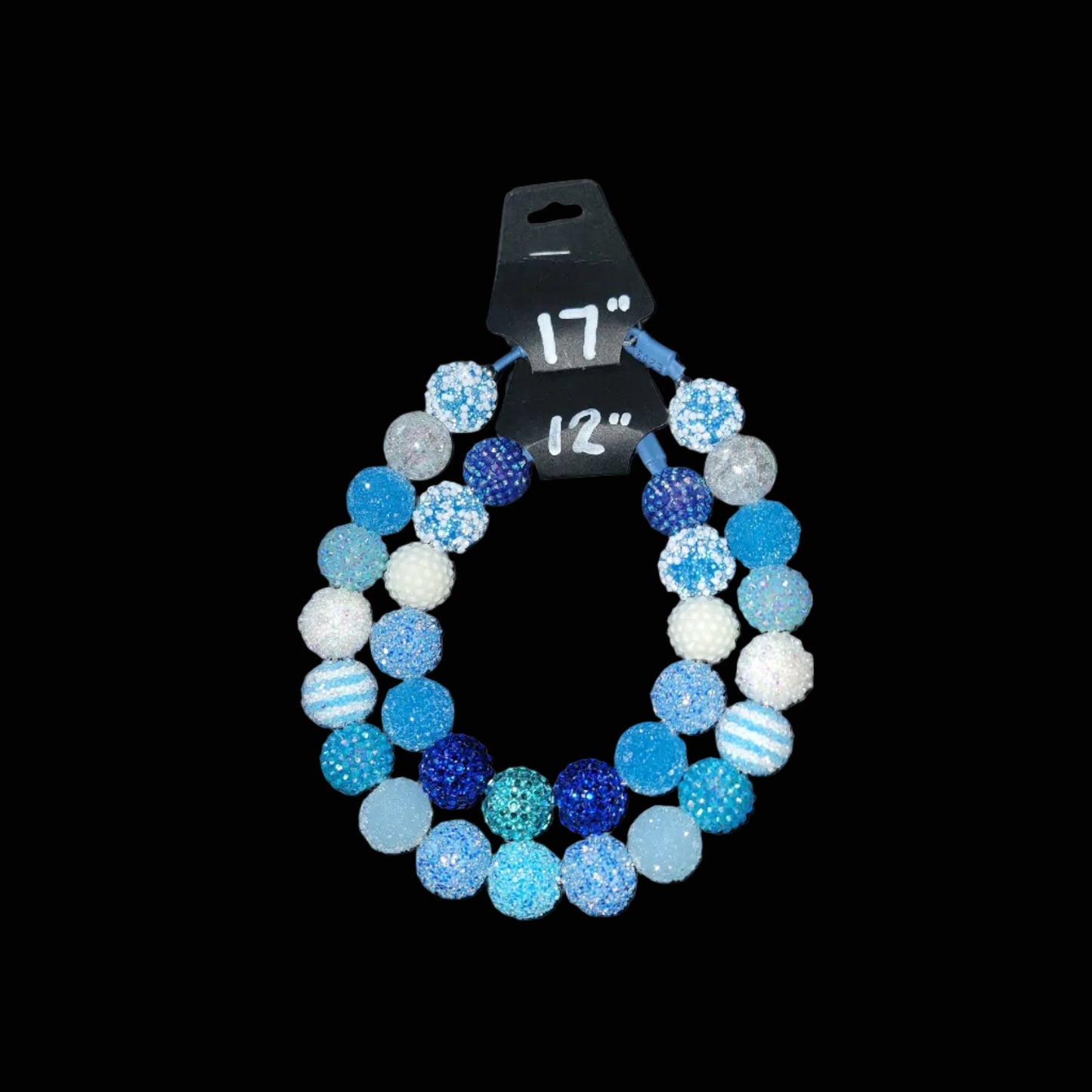 Colorful beaded bracelet with size label on a black background