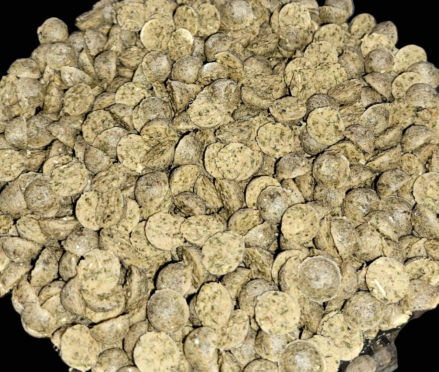 Close-up of round, brownish pet food pellets. Cat treat cat nip salmon treats fur babies