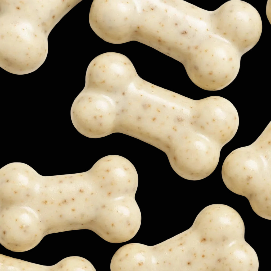 Dog treats shaped like bones on a white background