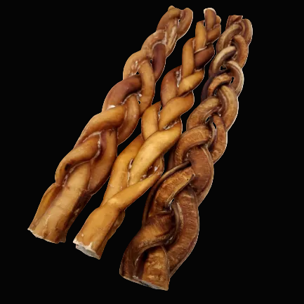 Three braided dog chew treats, varying in shades of golden brown and dark brown, arranged diagonally on a plain white background.