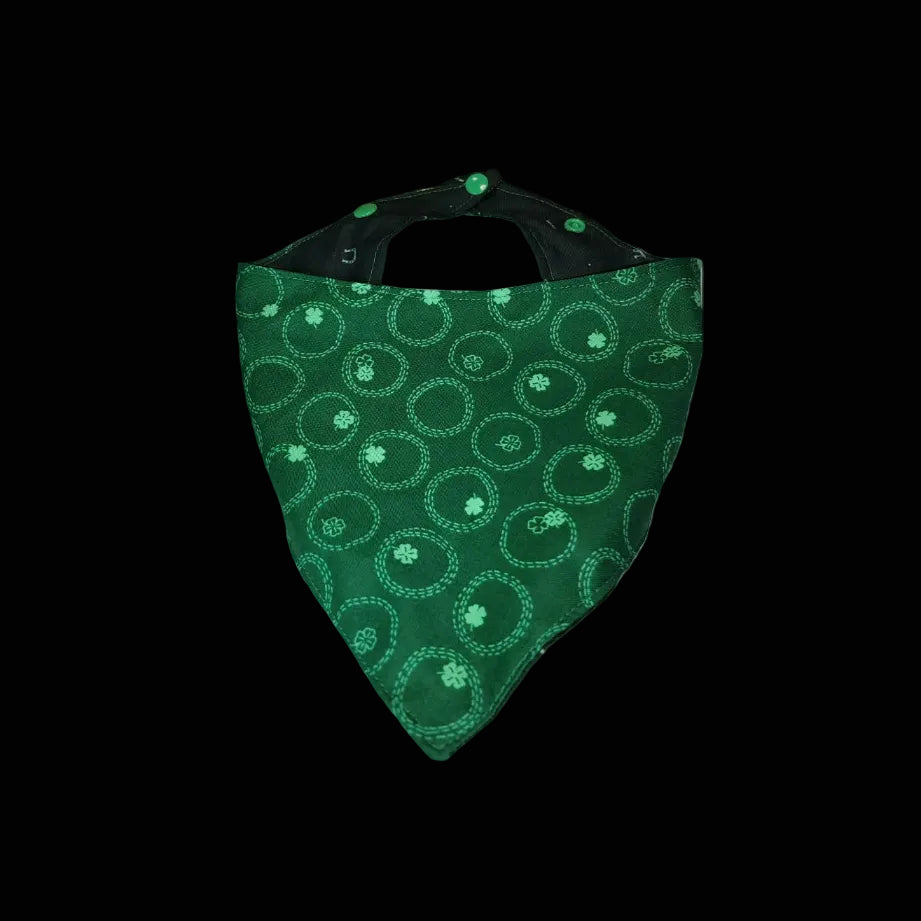 Green patterned bandana on a white surface with wooden background