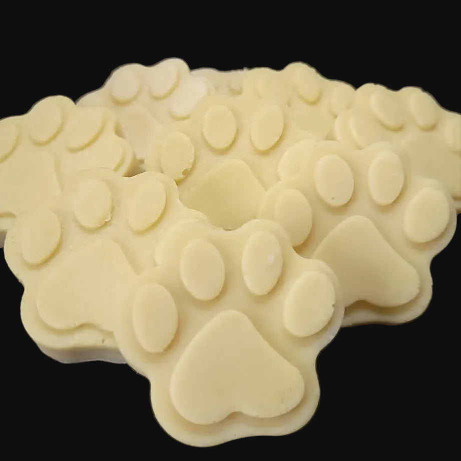 Paw print soap mold on a black surface