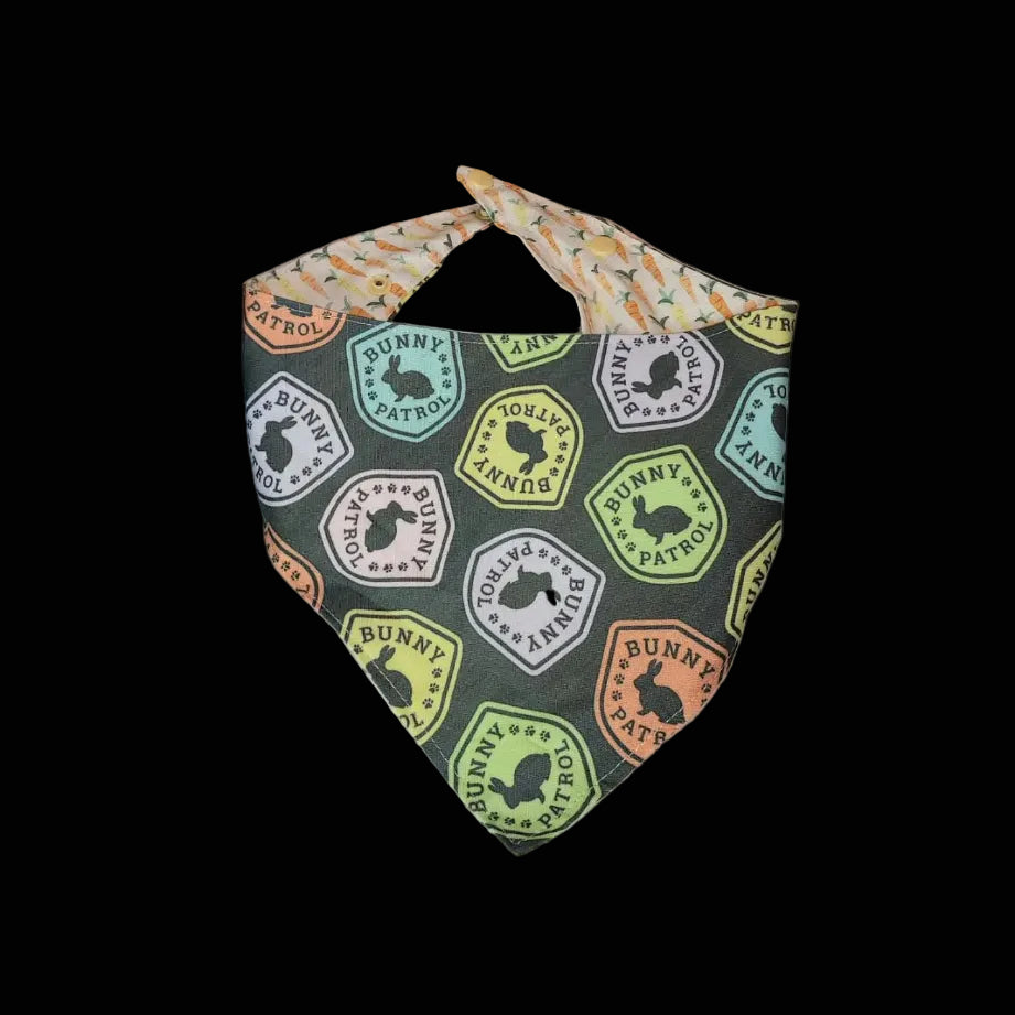 Fabric bandana with bunny pattern on a wooden surface
