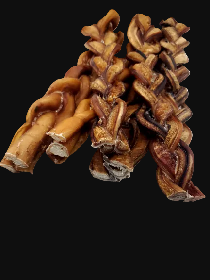 A pile of braided dog treats made from chewed hide, showing natural tan and dark brown colors, isolated on a white background.