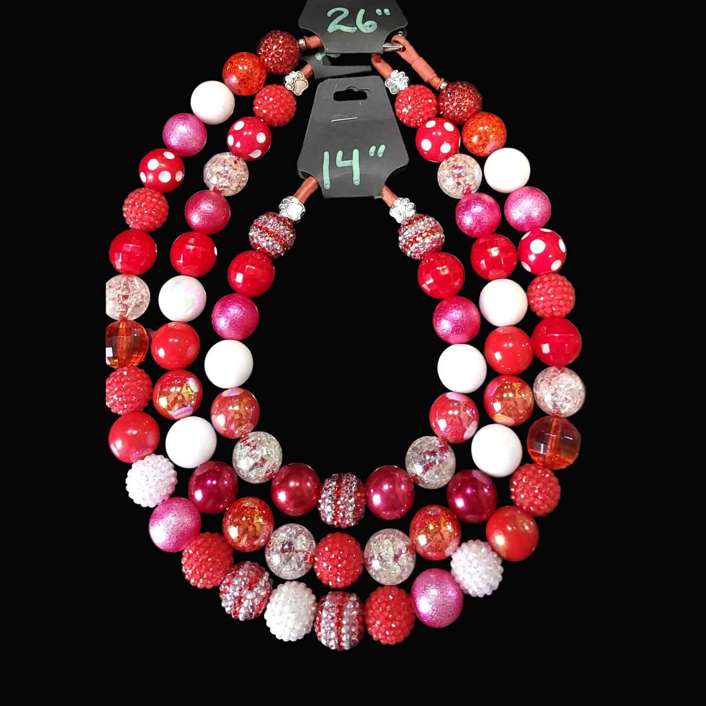 Colorful beaded bracelet with a black clasp on a dark background
